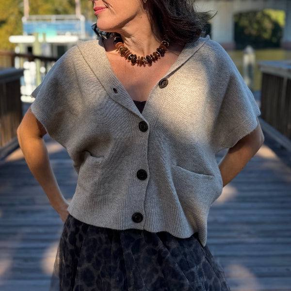 Tan sweater vest with buttons